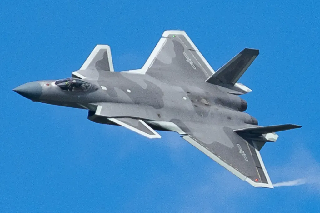 Chengdu J-20 twin-engine stealth fighter in flight, canards and diamond-shaped wing visible from below