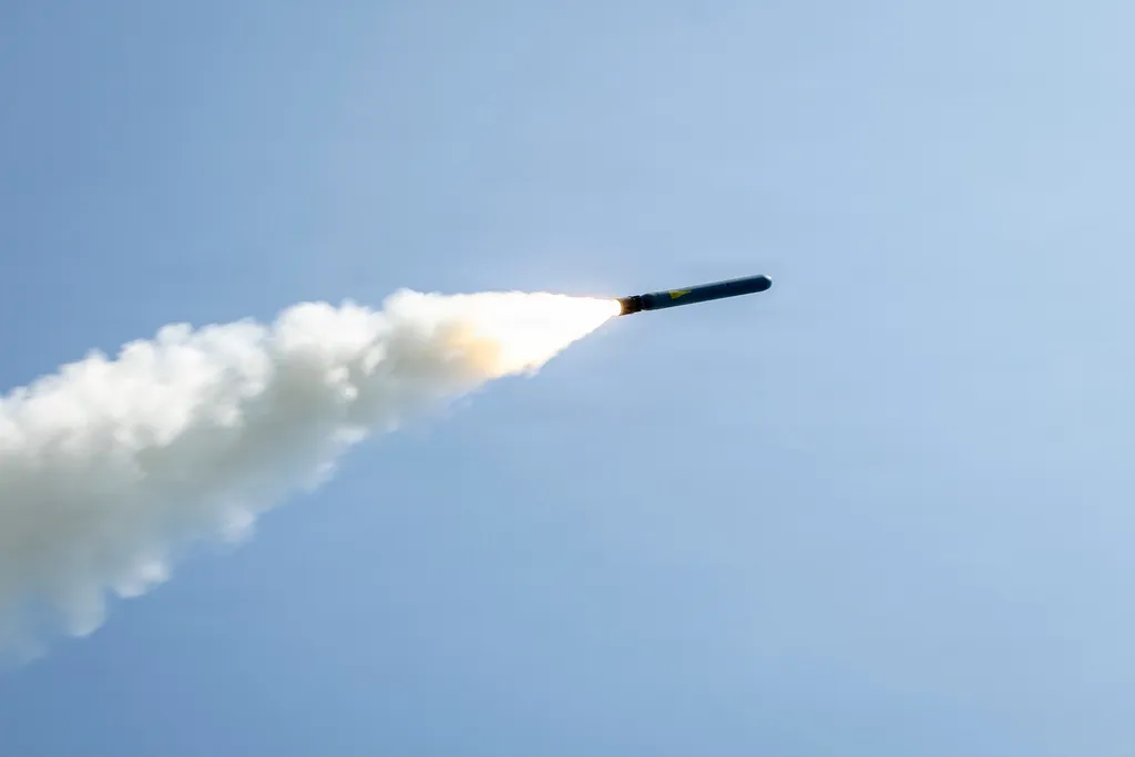 US Navy Arleigh Burke-class destroyer USS Delbert D. Black firing a Tomahawk cruise missile